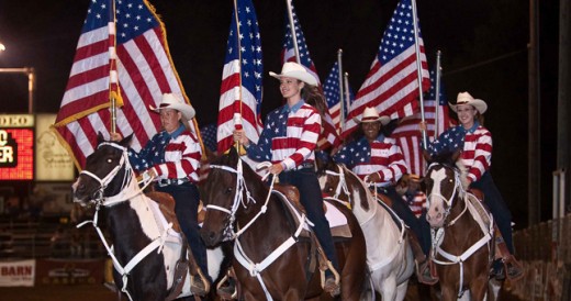 Girls Carrying Flags on top of Horses at the Poway Rodeo