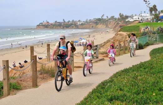 Enjoy a family ride along the Pacific Beach Boardwalk. Photo courtesy Brett Shoaf Artistic Visuals