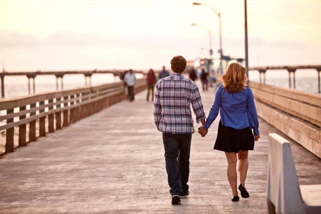 Couple Walking on Ocean Beach Pier