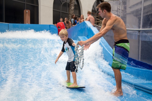 Learning to surf the Flow Ride Wave Machine at Belmont Park is just one of the fun activities in this summer day camp on the beach.