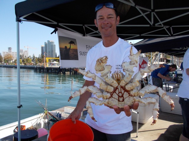 Posing with a big box crab at Tuna harbor Dockside Market!