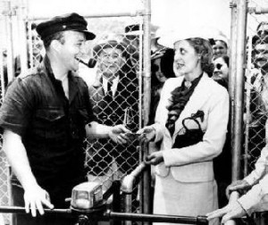 Bing Crosby, one of the founders of the Del Mar Racetrack, takes the first ticket on opening day, 1937.