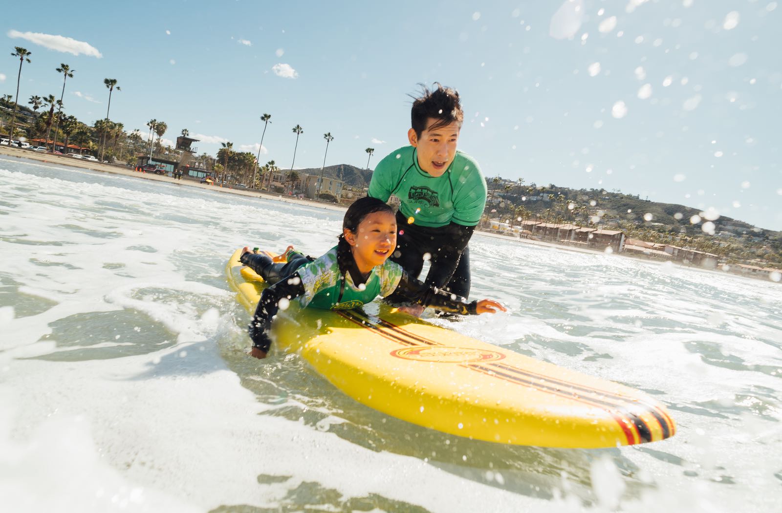 Father and Daughter Learning to Surf - Top Things to Do in San Diego