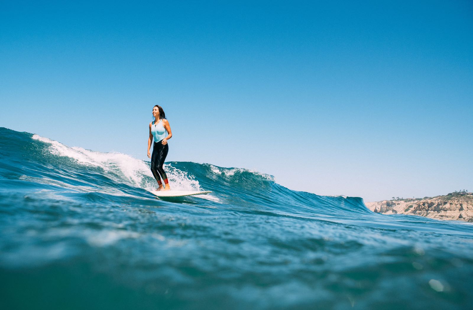Woman surfing in La Jolla - 10 Ways to Enjoy San Diego Surf Culture