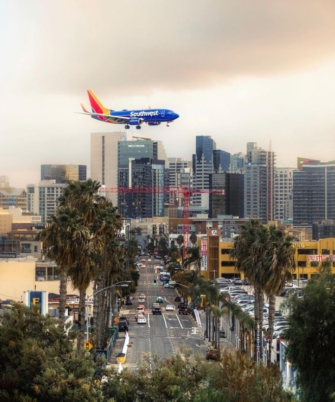 Plane coming in for a landing over downtown San Diego