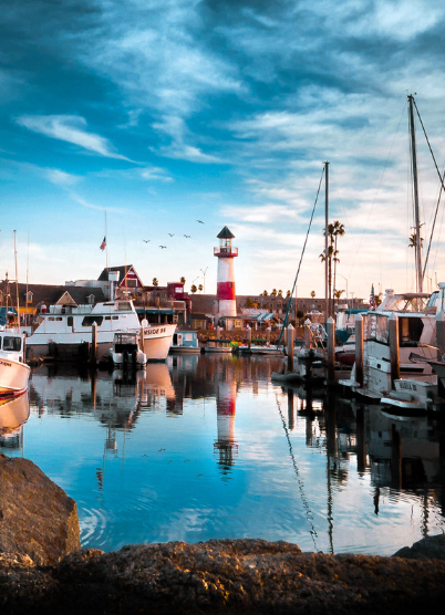 Boats and lighthouse at Oceanside Harbor