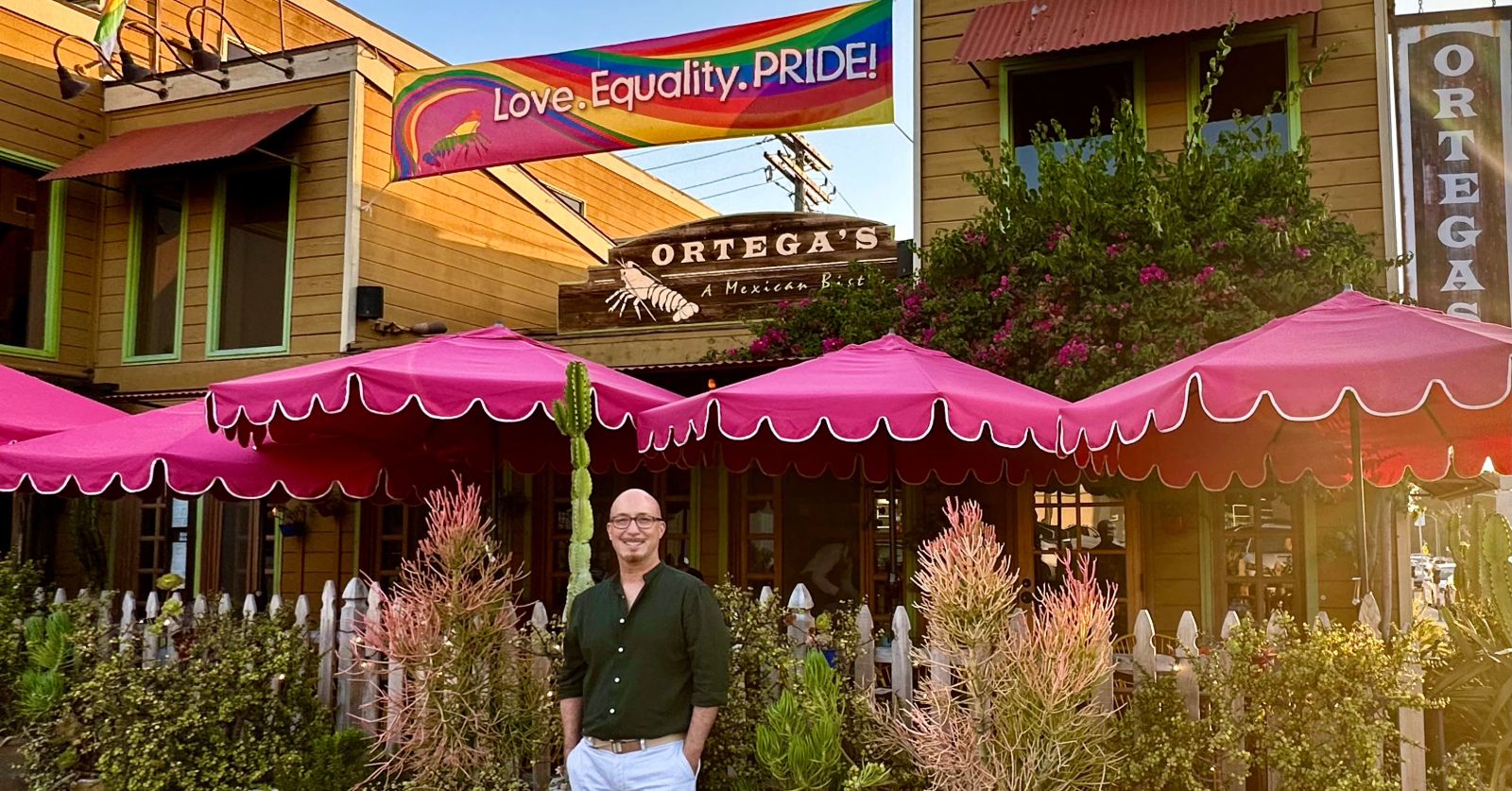 John Haugland standing in front of Ortega's, A Mexican Bistro