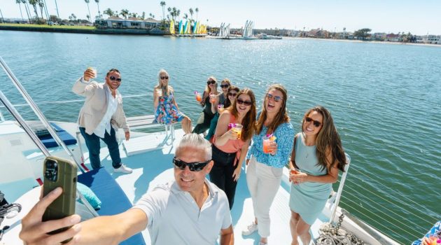 Group taking a selfie while boating on Mission Bay in San Diego