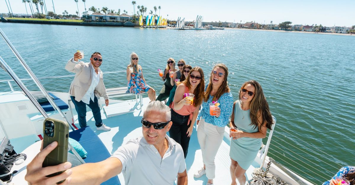 Group taking a selfie while boating on Mission Bay in San Diego