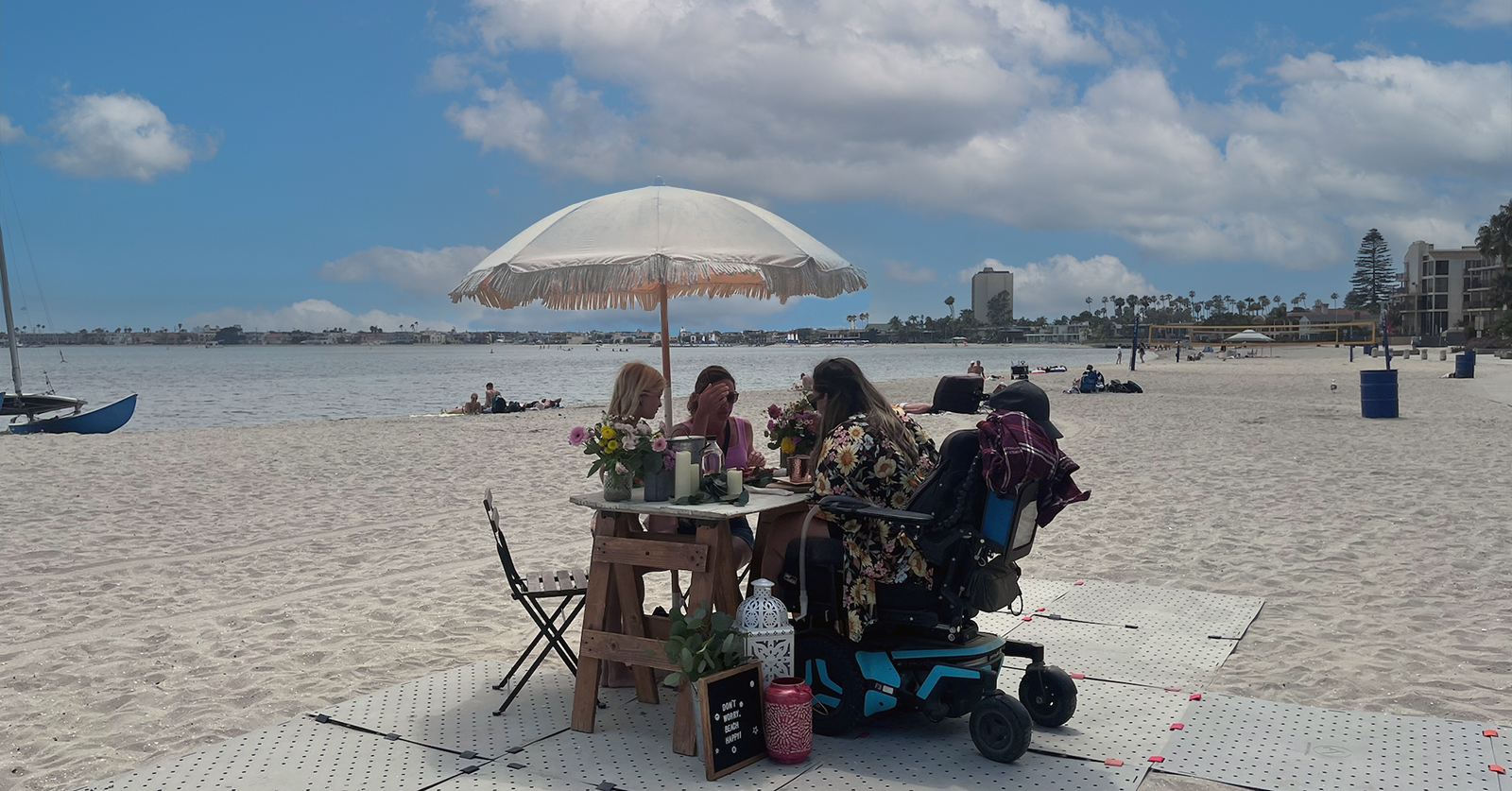 Family enjoying a accessible picnic at Mission Bay for Disability Pride Month